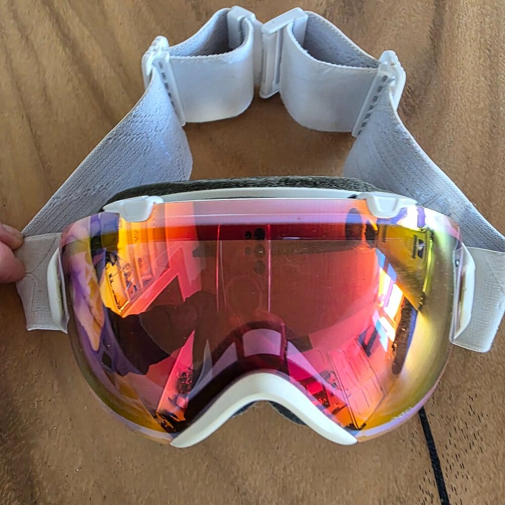 Smith Optics i/os snow goggles with photochromic red mirror lens.